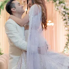 The groom lifts his bride in a joyful embrace during their engagement ceremony. This photo is full of life, love, and the excitement of starting a new chapter together.