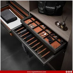 A complete organization system within a single drawer. This pull-out features a trouser rack, a tie and watch organizer, and a valet tray for a fully streamlined dressing experience.