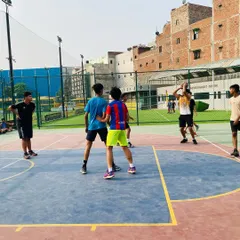 Players setting up a defensive formation during a scrimmage. I emphasize the importance of court awareness and communication.