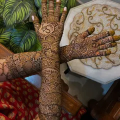 A beautiful Indian bridal design that extends up to the elbows. I love incorporating personal touches like the groom's initials, as you can see here.