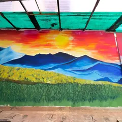 A straight-on view of the sunset landscape mural. The scale of the piece allows you to feel like you are really standing in that field, watching the sun go down.