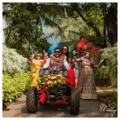 Making an entrance with a bang. The couple arrived at their Haldi ceremony in a decorated ATV, surrounded by friends and colorful smoke bombs for a fun, high-energy start to the festivities.