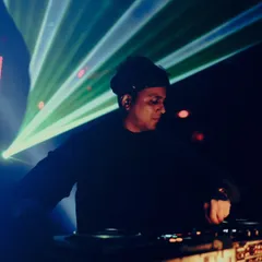 A close-up shot of me at Xora, Hyderabad, with green lasers in the background. In this moment, it's just me and the music.