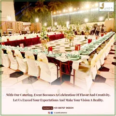 A formal outdoor dining setup with long tables, elegant seating, and a geometric-patterned floor, ready for a large celebration.
