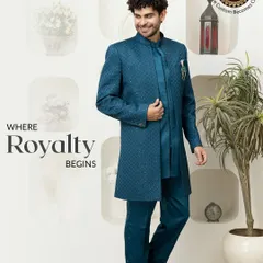 This striking teal Indo-Western sherwani is where royalty begins. The rich, textured fabric and long, structured silhouette offer a modern take on traditional groomswear, perfect for making a grand entrance.