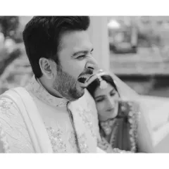 Real is where the story lives. The groom caught in a mid-yawn during a portrait session is not an imperfection, it's a reflection of their goofy, fun vibe. Monochrome makes this real moment feel timeless.