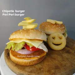 A look at my popular Jain burgers, available in Chipotle and Peri Peri flavors. I make the buns from scratch without yeast, and pair them with a delicious patty, fresh veggies, and cheese.