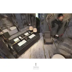 An overhead view of the master bathroom, showing the spacious layout that includes a seating area, a large vanity, and a freestanding tub. The design ensures the space feels open and opulent.
