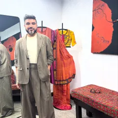 In my studio, wearing a bespoke taupe suit I designed. The relaxed, wide-leg silhouette reflects my love for fluid tailoring and modern design.