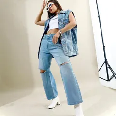 A full denim-on-denim look from the archives. I styled ripped wide-leg jeans with a matching denim vest and white boots for a cool, cohesive outfit with a 90s vibe.