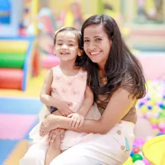 A warm hug and a happy smile. I designed this space to be a welcoming place for parents and children to connect.