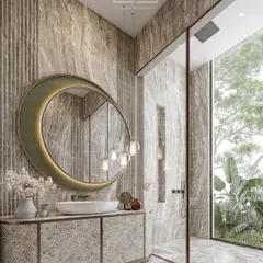 This bath space balances nature’s serenity with architectural precision. A refined material palette, organic forms like the crescent-shaped mirror, and ambient lighting make every moment a retreat.