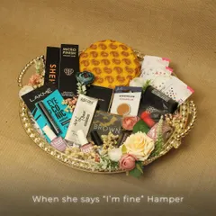 The "When she says 'I'm fine'" hamper. A playful and thoughtful gift idea, this tray is packed with a variety of makeup essentials to surely bring a smile to her face.