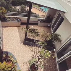 An aerial view of a terrace we designed at Klassik Landmark. This project involved installing custom flooring, large planters for small trees and shrubs, and a sleek pergola to create a multi-functional outdoor space.