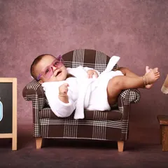 Kicking back and relaxing. This shot captures the pure confidence and charm of a six-month-old, perfectly at ease in the miniature lounge setup I created for this milestone session.