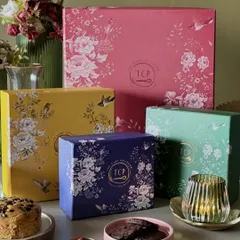 Our floral-themed gift boxes, like the Utkarsha and Prana, are a feast for the eyes and the palate. They are filled with a variety of our artisanal nuts, granola, and tea cakes, perfect for any festive occasion.