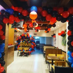 Vroom vroom! We decorated this entire space for a Racing Cars themed party. The decor included a custom balloon backdrop for the cake table and matching balloon bunches floating on the ceiling.