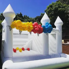Our elegant white bouncy castle, shown here with a slide and ball pit, is a versatile choice for any event, from birthdays to more formal gatherings. It can be decorated with balloons to match your party's theme.