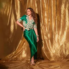 For the 'Heeramandi' promotions, we styled Sonakshi Sinha in this regal green draped ensemble by Anamika Khanna. The look, complete with intricate embroidery and traditional jewelry, was designed to reflect the grandeur of the series.