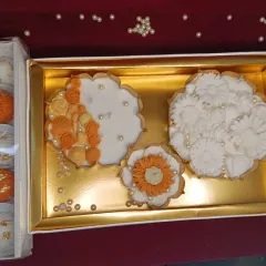 This is one of my urli candle gift sets. It includes three different floral urli candles and a box of laddoo and modak candles, all presented in a beautiful gift box.