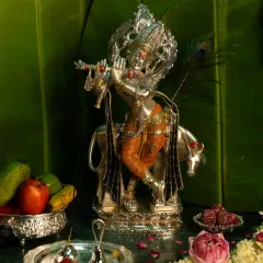 Celebrate the spirit of Janmashtami with my pure silver Krishna idol. This masterpiece of devotion and craftsmanship is perfect for your pooja room decor, festive celebrations, or as an auspicious gift of love.