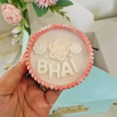 A close-up of my custom Rakshabandhan candle, personalized with 'BHAI'. These are made with soy wax in a hand-poured eco-resin jar, available in 15 vessel shapes and 10 fragrances to match your festive decor.