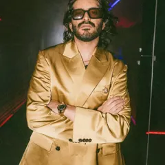 Actor Harshvarrdhan Kapoor styled by our team for an H&M event. His long hair is given a natural, textured look that complements his high-fashion gold suit.
