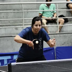 A veteran player demonstrates perfect form during a match. Our academy welcomes players of all ages, creating a diverse and challenging environment for everyone from juniors to seasoned veterans.