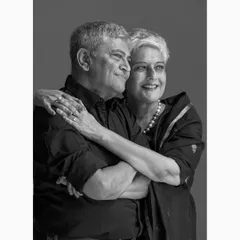 A serene and composed portrait of a couple, reflecting their deep bond and shared journey. This classic black and white style ensures the portrait remains timeless for generations.