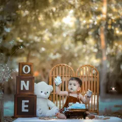 The best part of a cake smash is the mess. This little boy is having a blast with his birthday cake during an outdoor session, creating fun and unforgettable memories of his first birthday.