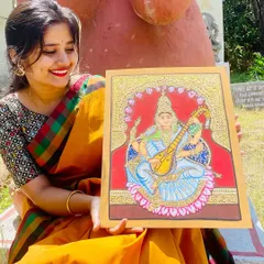 A close-up of my completed Mysore-style painting of the goddess Saraswati. This traditional art form is known for its delicate lines, intricate details, and the use of real gold foil.