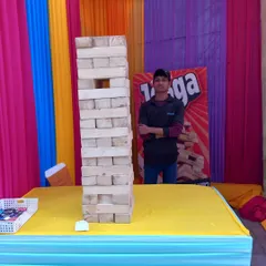 The giant Jenga game is always a hit. Guests love the suspense of carefully pulling out blocks from the massive tower, making it a great interactive stall for any party.