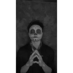 The same Coco-inspired skull makeup, shown in black and white to emphasize the linework and shading. This view highlights the contouring used to create the hollowed-out effect.
