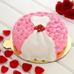 Perfect for a bridal shower, bachelorette party, or a fashion lover's birthday. This cake is decorated with pink rosettes and features a beautifully crafted fondant dress design.