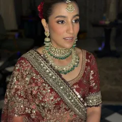 Another angle of this classic bridal makeup. You can see the soft blush and highlighter placement that gives the cheeks a healthy, flushed look without appearing heavy.