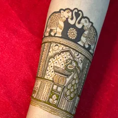 A bridal start-up design, featuring elephants and peacocks. This is the beginning of a full-arm masterpiece.