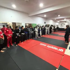 Lined up and ready to learn. Our members listening intently during a Jiu-Jitsu seminar with a guest professor. We are always students of the art, constantly seeking knowledge.