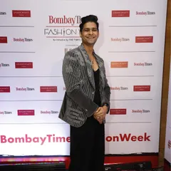 Vinay Mishra at Bombay Times Fashion Week in the same grey velvet coat. This look shows its versatility, styled here for a fashion-forward event with an all-black base to let the embroidery shine.
