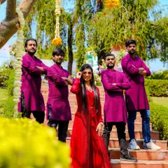 Posing with my band, my musical family. We love coordinating our outfits and bringing a professional and united look to our performances.