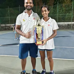 Lucy (Tuhina) Roy with her coach after winning the All India Championship Series Under 14 Doubles title in Mumbai.