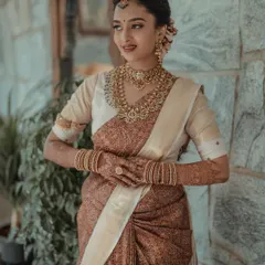 A portrait of timeless South Indian bridal beauty. I focus on capturing the intricate details of the silk saree, the temple jewelry, and the bride's serene expression.