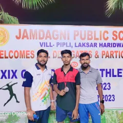 Standing with one of my athletes and his medal. My role is to guide them, whether it's in Kho-Kho or any other sport they choose to excel in.