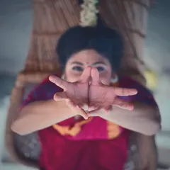 This is the 'padmakosha' hasta, or lotus bud hand gesture, a fundamental element of Bharatanatyam's vocabulary. This image is part of a series exploring 'aharya' (adornment) and how it shapes a dancer's identity, a concept discussed in the ancient text, the Natya Shastra.