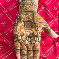 A classic design for the palm featuring a grand, decorated elephant under a royal archway. The fingers are detailed with delicate, traditional patterns.