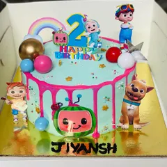 A fun Cocomelon themed cake for a second birthday, featuring JJ and his friends.