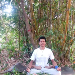 Meditating in Padmasana, the Lotus Pose, amidst a bamboo grove. Yoga is a science that deals with the body, mind, and soul, and through this practice, we can connect with the universe itself.