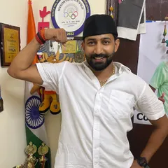 A moment at home, surrounded by the medals and trophies my athletes have won. Their success is my pride. Jai Hind!