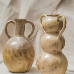 These two wheel-thrown vases, with their beautiful, earthy glaze and classic forms, were made by students in our Foundation course. They reflect a journey of experimenting, shaping, and expressing through form and texture.