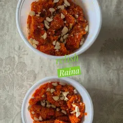 Individual portions of my carrot halwa, topped with cashews. The vibrant color and sweet, nutty flavor make it a favorite.