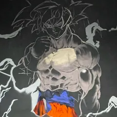 Another process shot of the Goku piece. You can see the layers building up, from the initial sketch to the shading and color. It's a process of bringing the character to life.